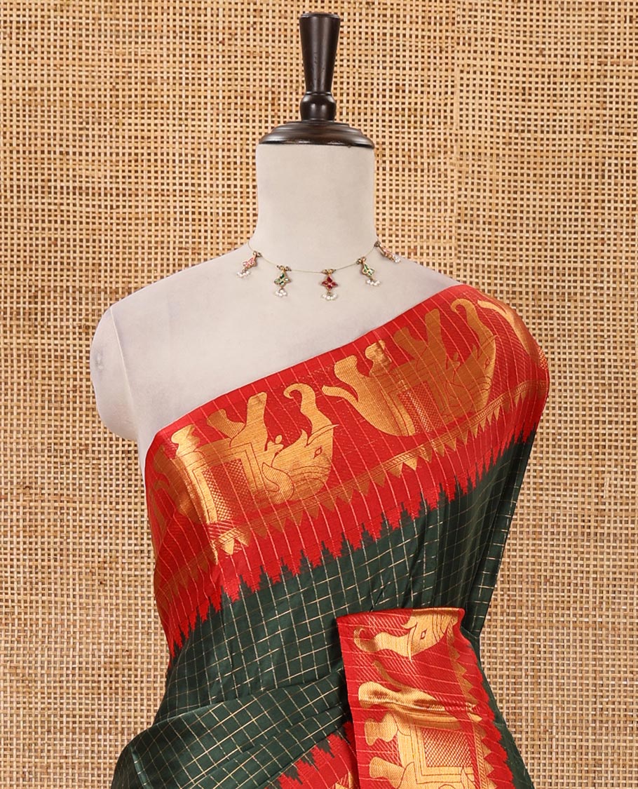 Bottle green checked semi-tafeta saree, contrast temple zari elephant motifs border, striped pallu & matching checked zari border blouse