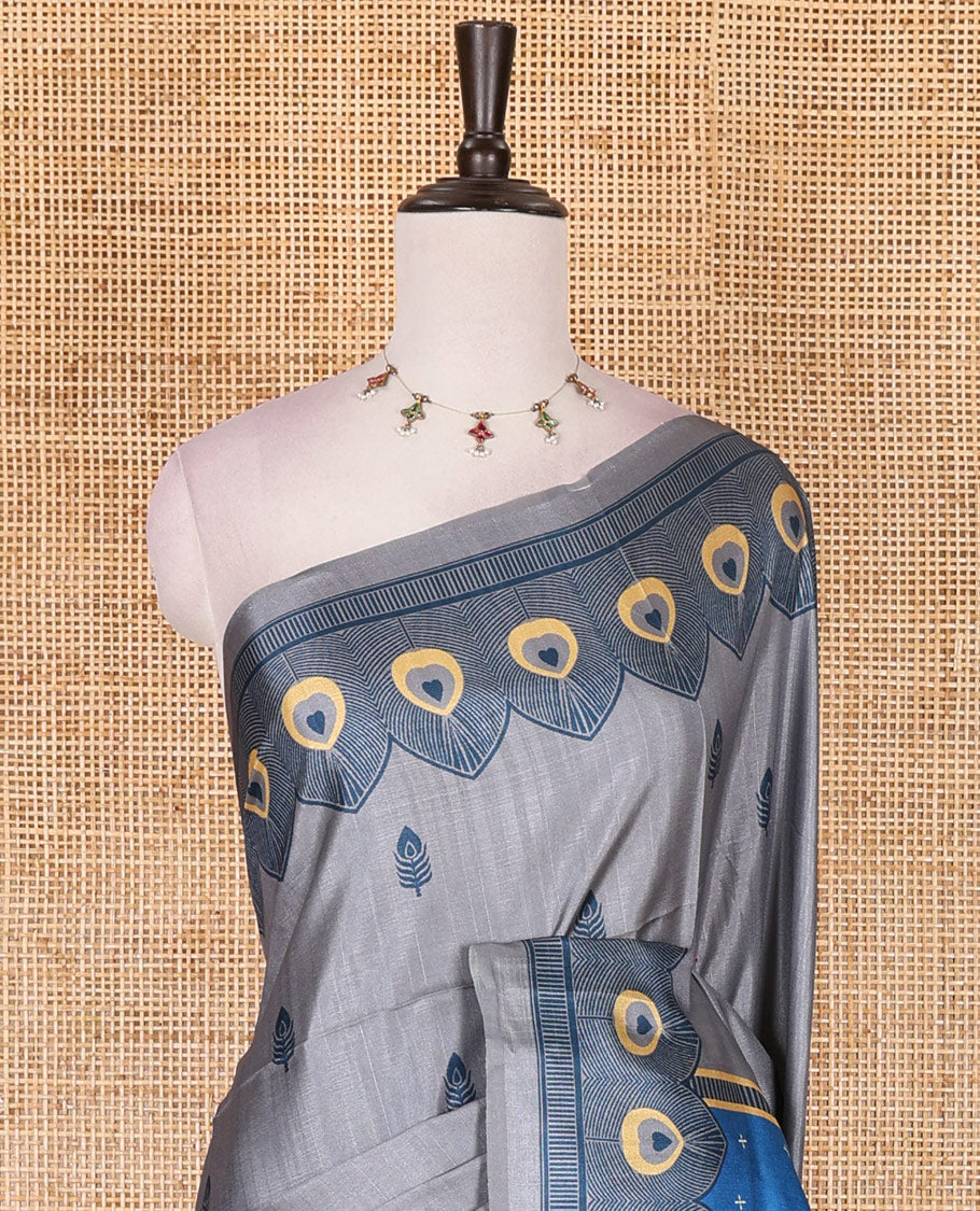 Grey peacock feathers motifs printed katan silk saree, peacock feathers printed border, contrast Radha Krishna stories printed pallu, and contrast printed blouse
