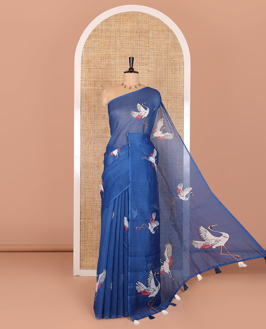 Borderless blue crane motifs printed linen cotton saree, crane motifs printed pallu, and a contrast crane printed blouse