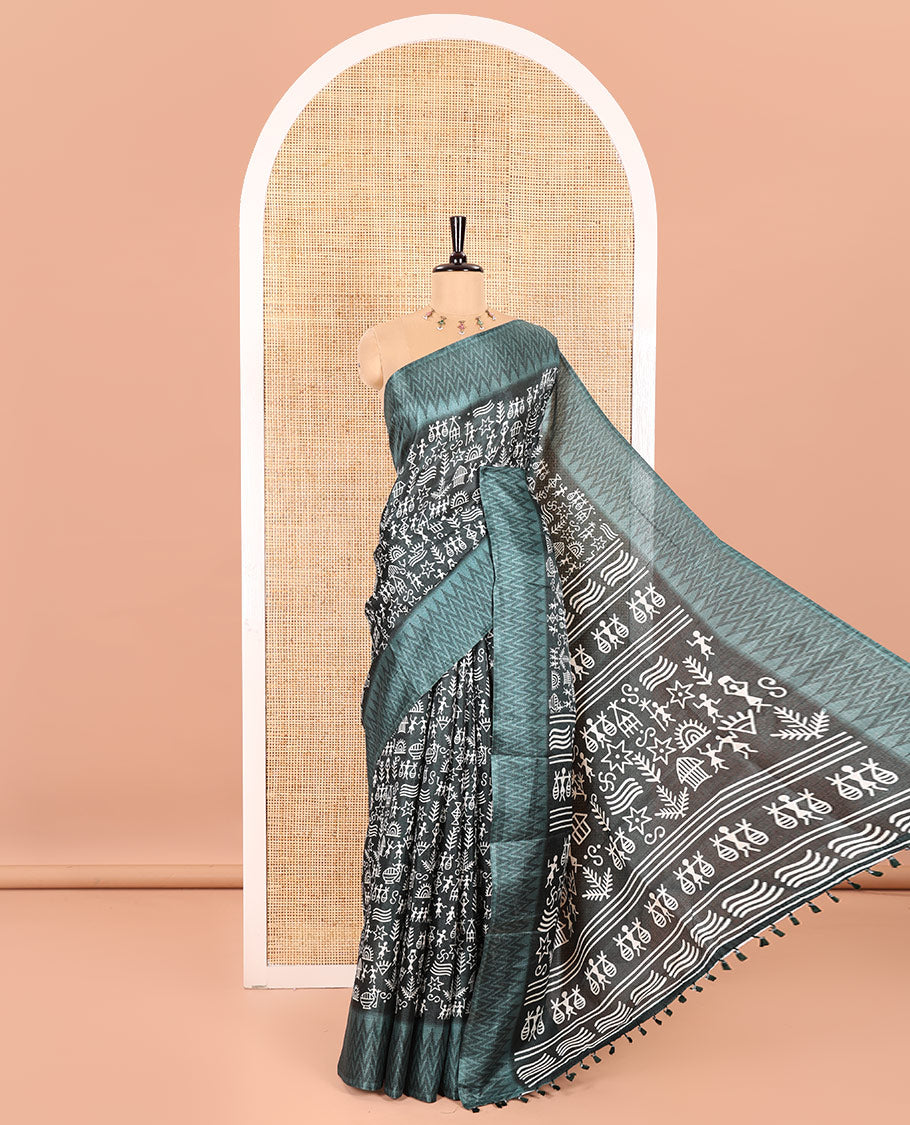 Green Art Khadi Cotton Saree Adorned with Warli-Village Theme Print, Complemented with a Contrasting Chevron-Printed Border, Vibrantly Warli-Printed Pallu, and a Plain Blouse