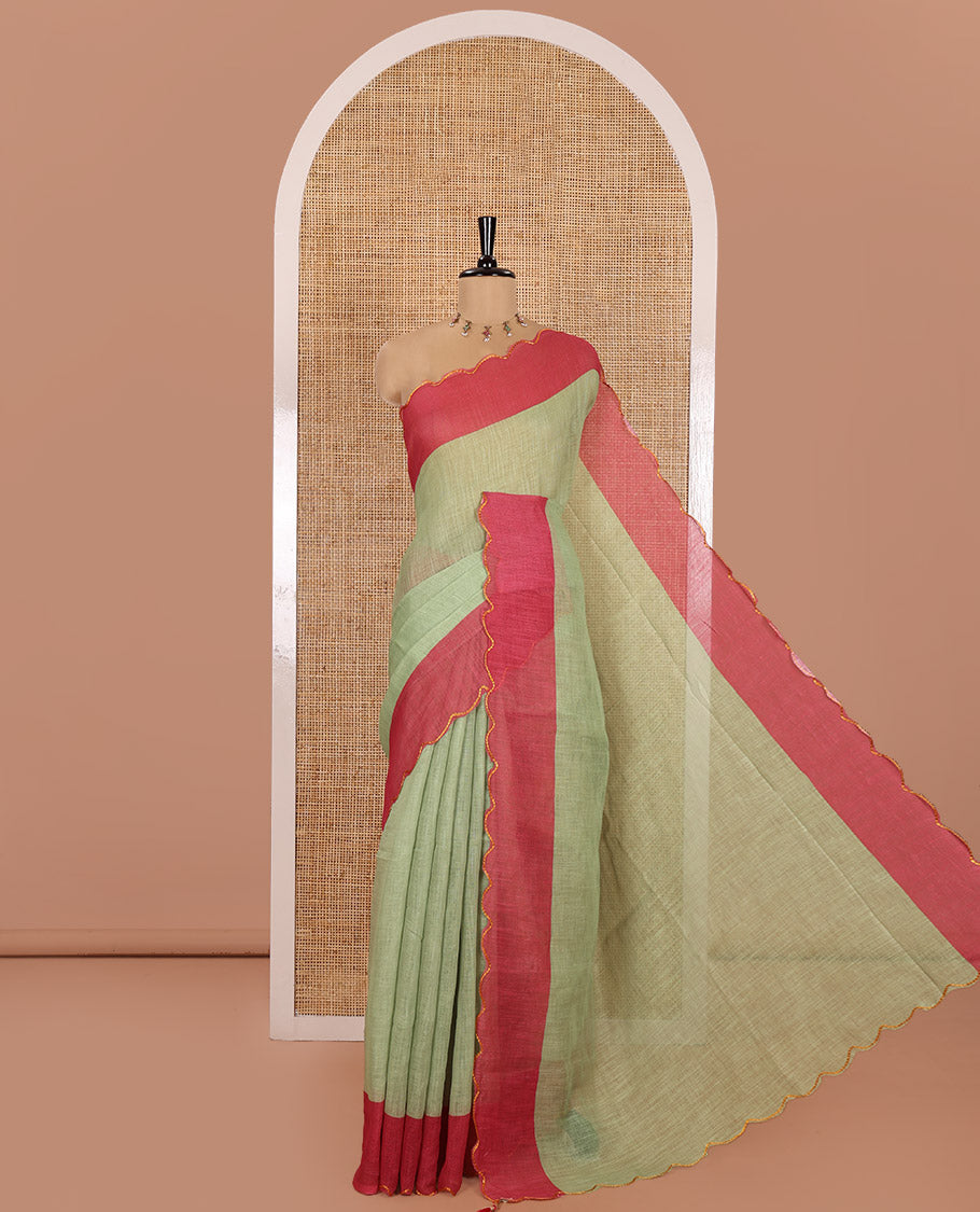 Green Plain Linen Cotton Saree, Complemented by Contrast Scallop Border, Plain Pallu, and Paired with a Contrast Floral Printed Mirror Embroidered Blouse