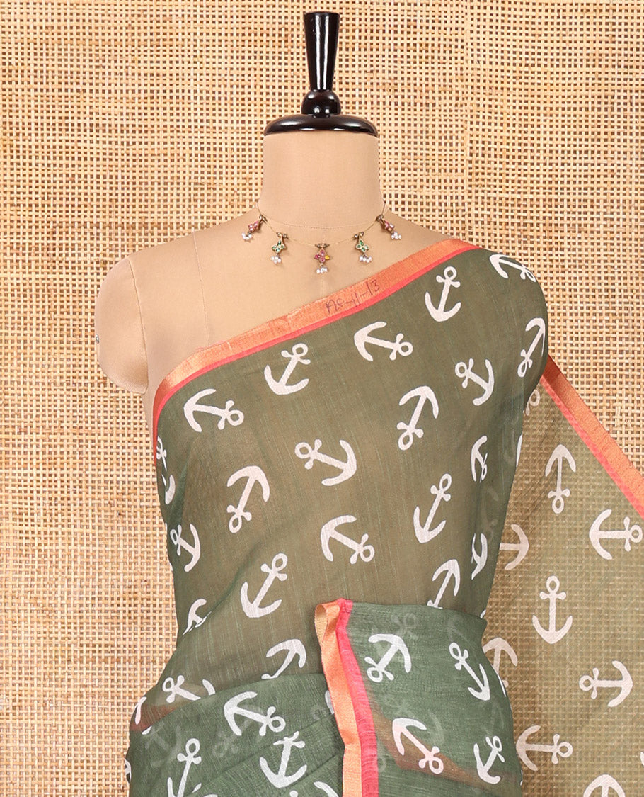 Olive Green Linen Cotton Saree, Steeped with Anchor Motifs Printed on Its Body, a Subtle Contrast Piping Border, Multi-Color Striped Pallu, and Paired with a Contrast Blouse