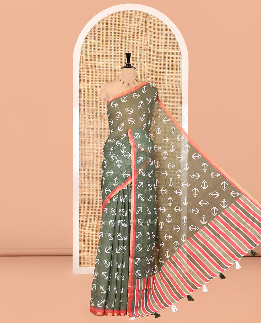 Olive Green Linen Cotton Saree, Steeped with Anchor Motifs Printed on Its Body, a Subtle Contrast Piping Border, Multi-Color Striped Pallu, and Paired with a Contrast Blouse