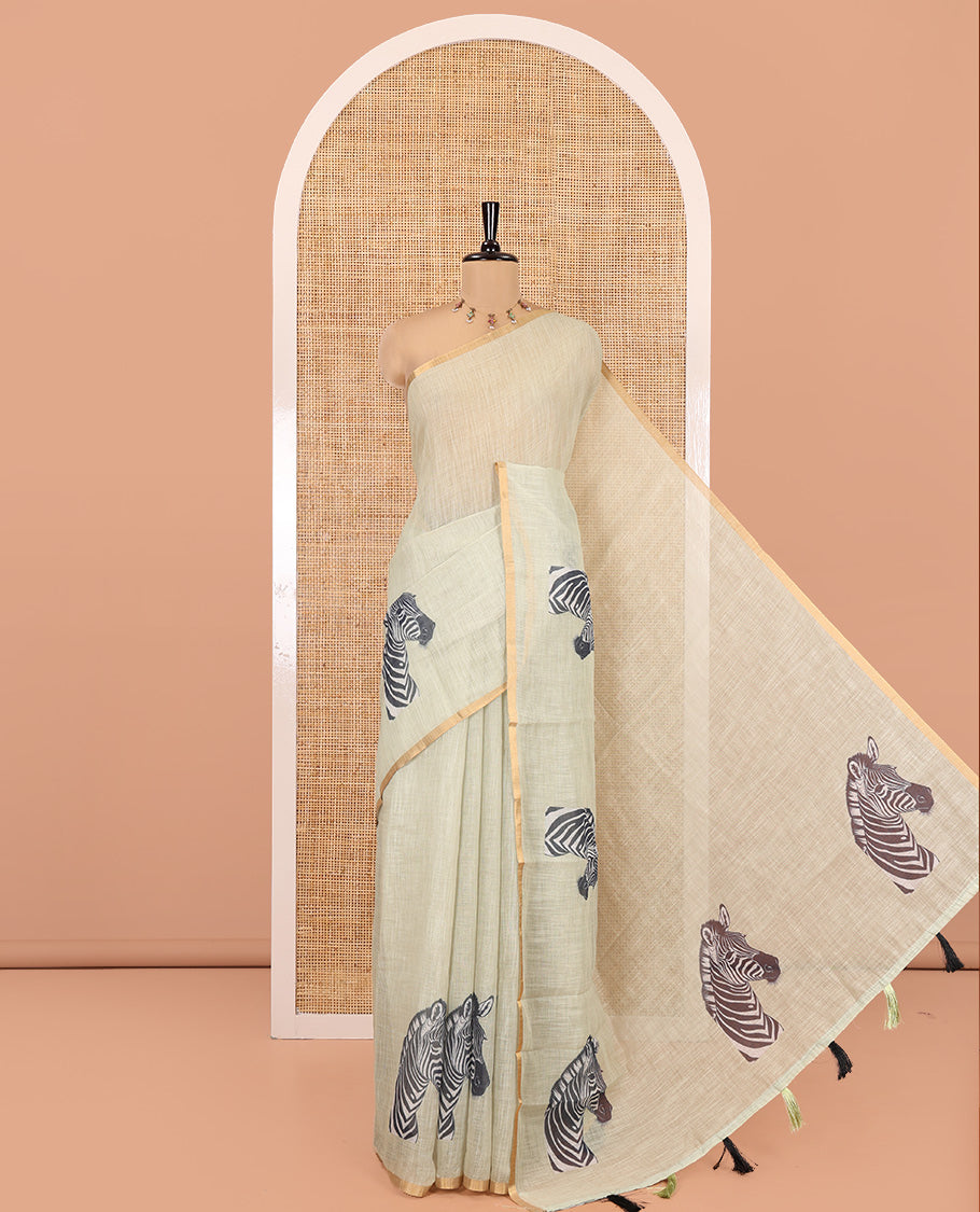 Pista Green Linen Cotton Saree, Accentuated with Zebra Motifs Print, A Subtle Piping Border, Zebra Printed Pallu, and Comes with a Contrast Blouse