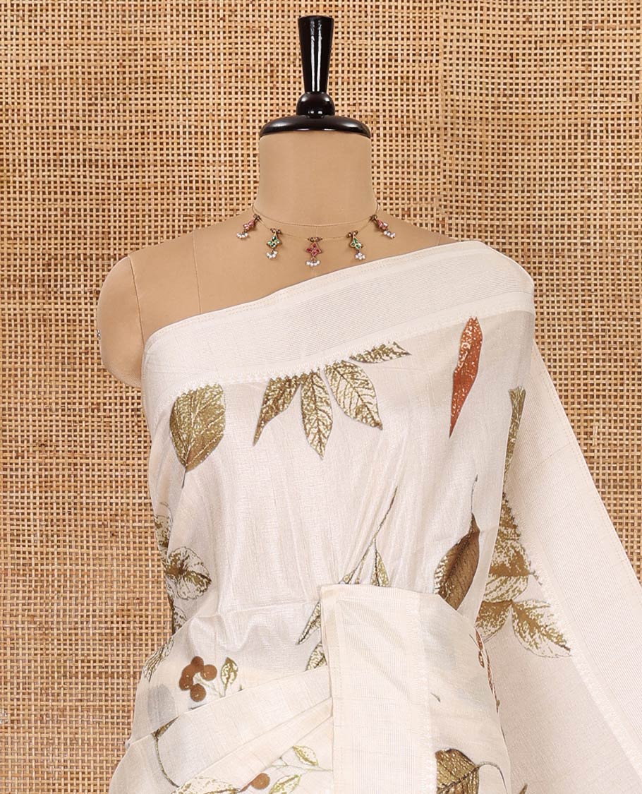Off-White unique size and shaped leaf motifs printed fancy tussar saree, resham thread woven border, leaf motifs printed pallu, and a matching striped blouse