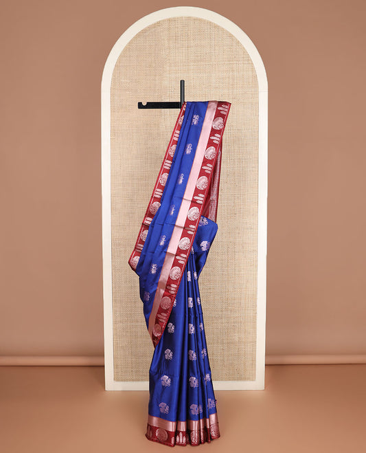 Blue zari buttas silk saree, contrast temple geometric patterned border, and jaal pallu