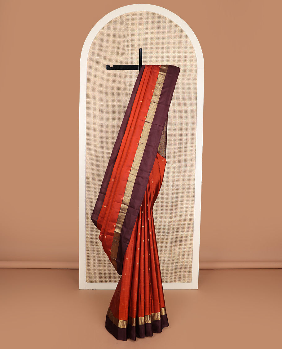 Orange zari buttas silk saree, contrast border of reeku, banaras, and ara maadam designs, and jaal pallu