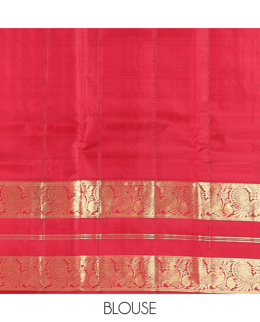 Red Vasundhara Silk Saree Majestically Detailed with Zari Designs, Highlighted by a Zari Border of Muthu, Banaras, and Mayil Designs, Grandly Detailed Pallu of Jaal Design, and a Matching Blouse