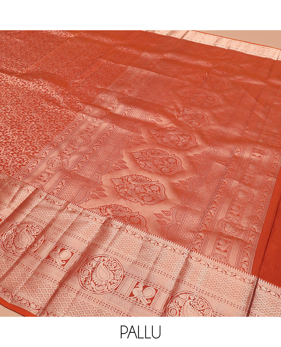 Rust Orange Kanchipuram Silk Saree Elegantly Designed with Jacquard Design, Highlighted with Zari Border of Thilakam, Muthu, Kodi Visiry, Jaal, Manga, and Mayil Designs, Majestically Detailed Pallu, and Paired with a Matching Blouse