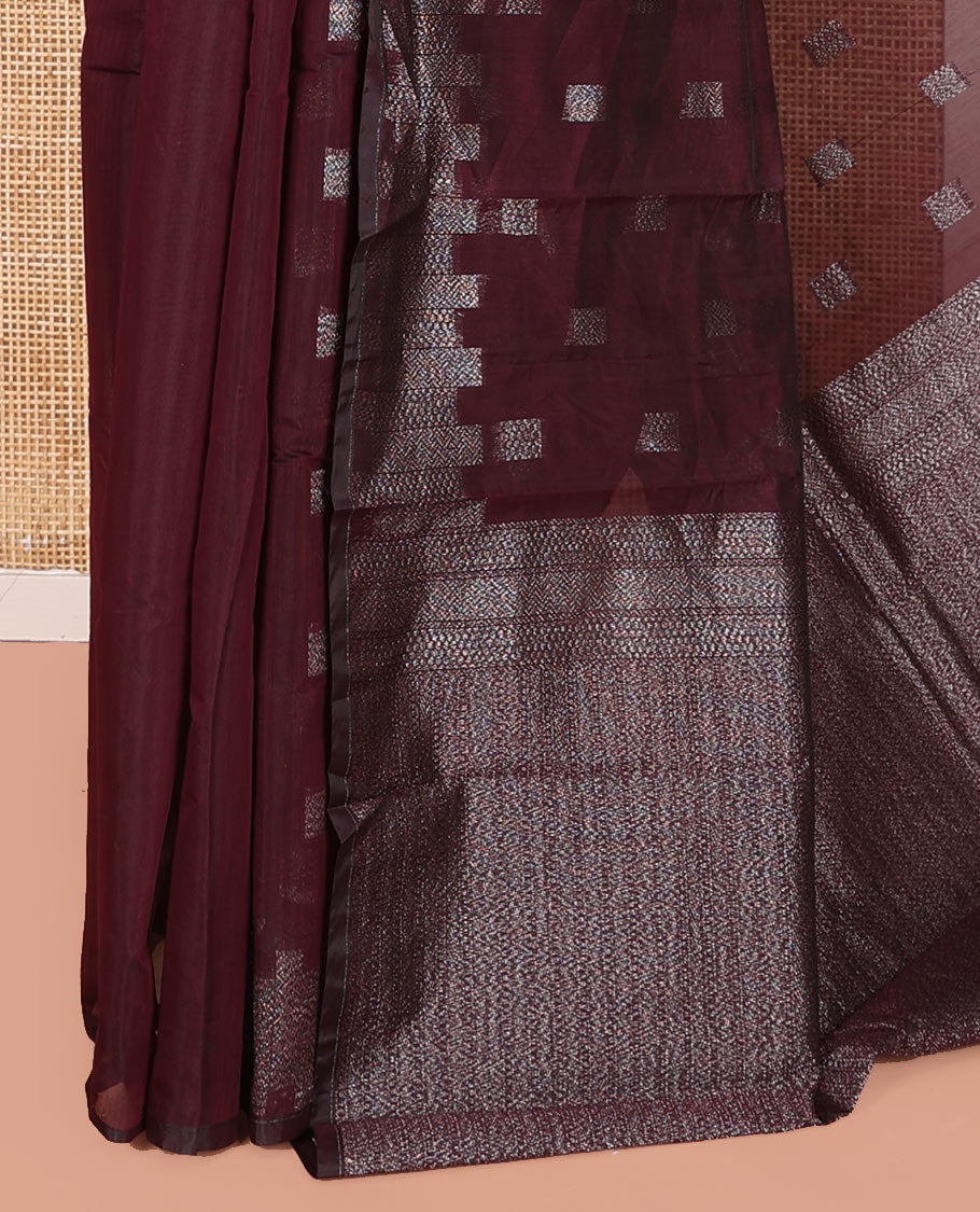 Maroon Semi-Silk Cotton Saree, Detailed with Buttas on Its Body, Highlighted by a Zari Geometric Border, Gleaming Zari Decked Up Pallu, and Paired with a Matching Blouse