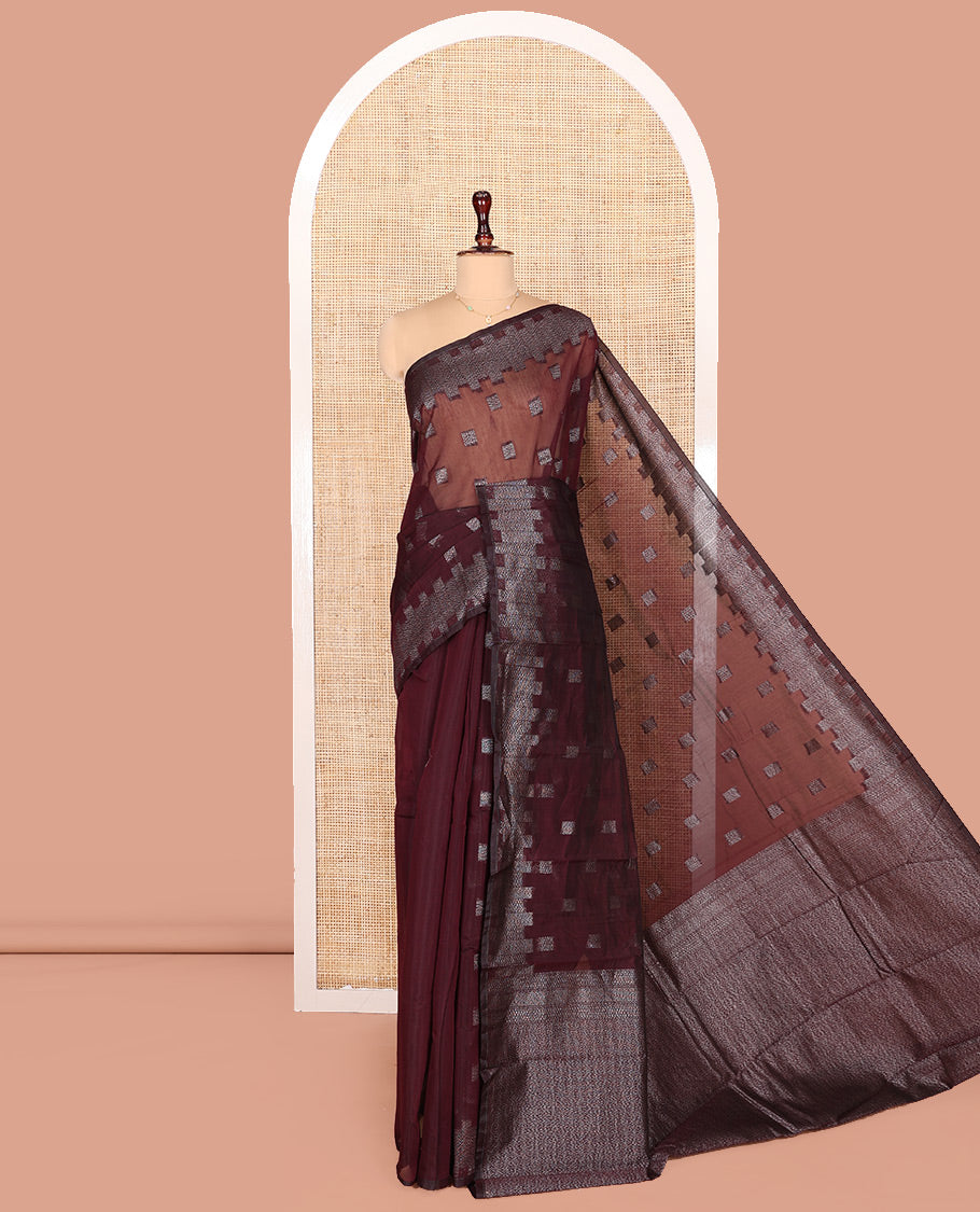 Maroon Semi-Silk Cotton Saree, Detailed with Buttas on Its Body, Highlighted by a Zari Geometric Border, Gleaming Zari Decked Up Pallu, and Paired with a Matching Blouse