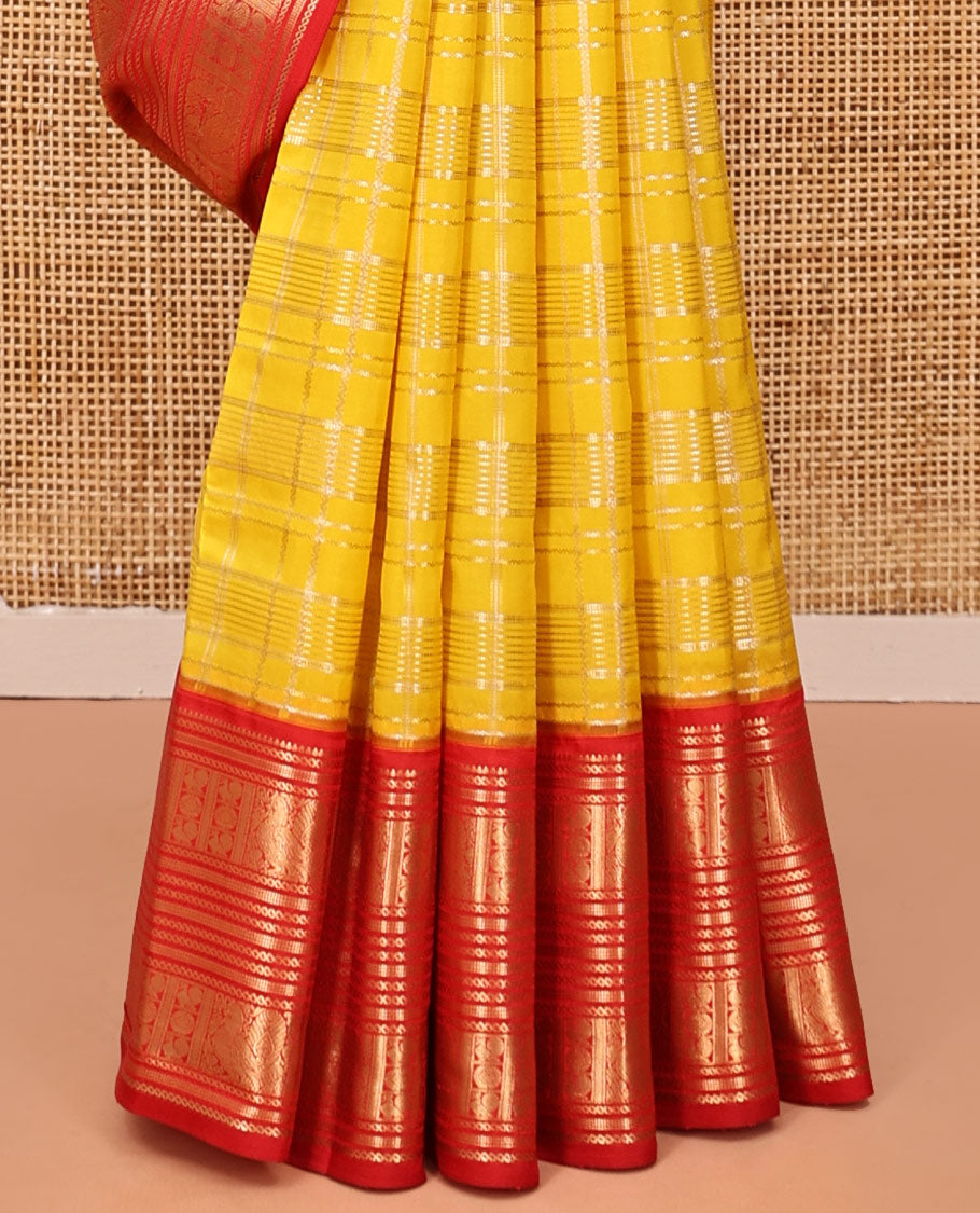 Lemon Yellow and Red Vasundhara Lite Silk Saree, Richly Detailed with Zari Checked Design On Its Body, Complemented by Contrast Varisai Pettu Border of Mayil Chakram Designs, Grand Jaal Pallu, and Paired with a Contrast Blouse
