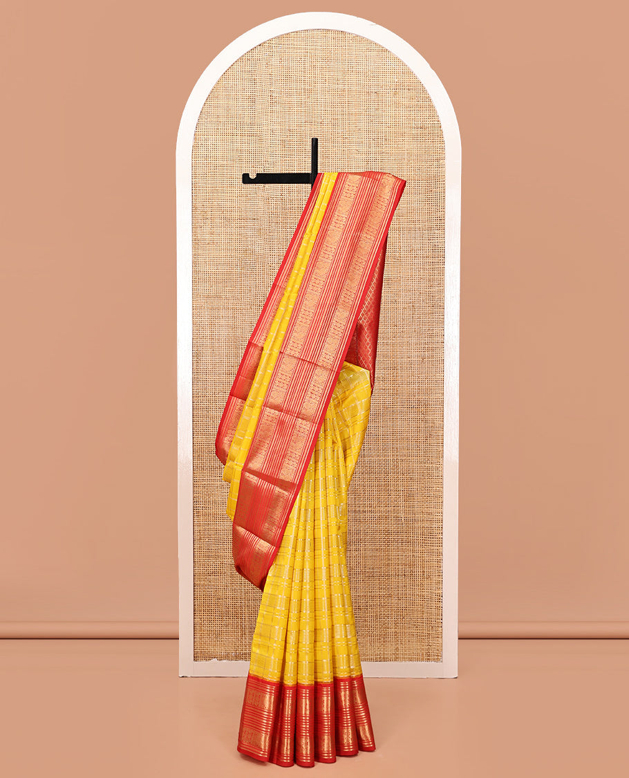 Lemon Yellow and Red Vasundhara Lite Silk Saree, Richly Detailed with Zari Checked Design On Its Body, Complemented by Contrast Varisai Pettu Border of Mayil Chakram Designs, Grand Jaal Pallu, and Paired with a Contrast Blouse