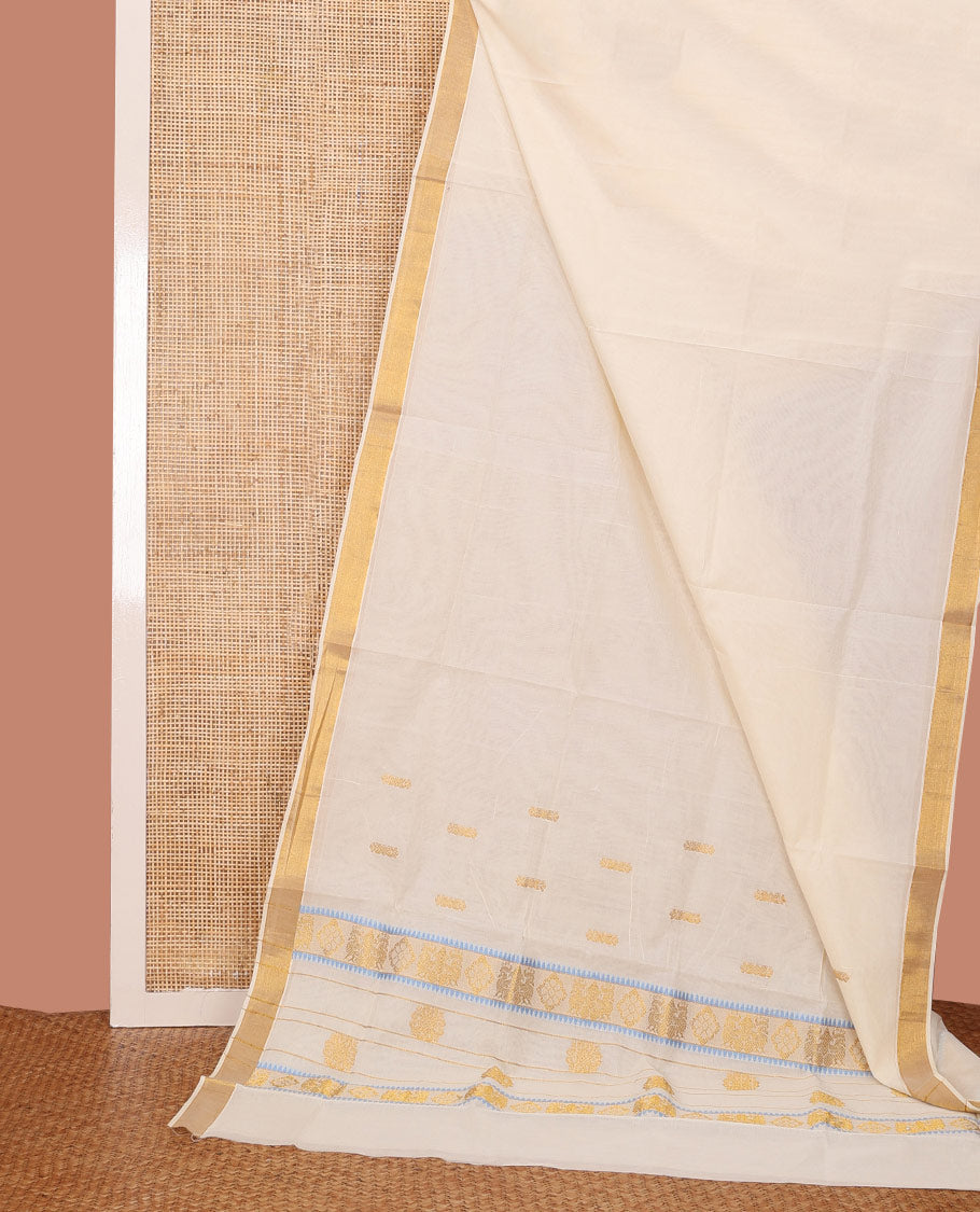 Cream Kerala Saree, Decked Up with Zari Buttas on Its Body, Bavanji Zari Border, Pallu Delicately Woven with Zari Designs, and Paired with a Matching Blouse
