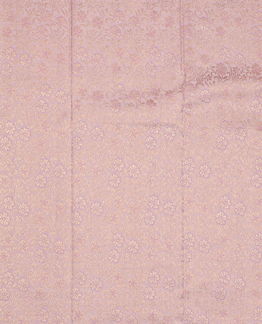 Pink pure-silk half-saree, jacquard skirt, contrast blouse, and border of rekku, poun, floral, kuyil kann, diamond, and then kuli kann designs, and intricate dhavani