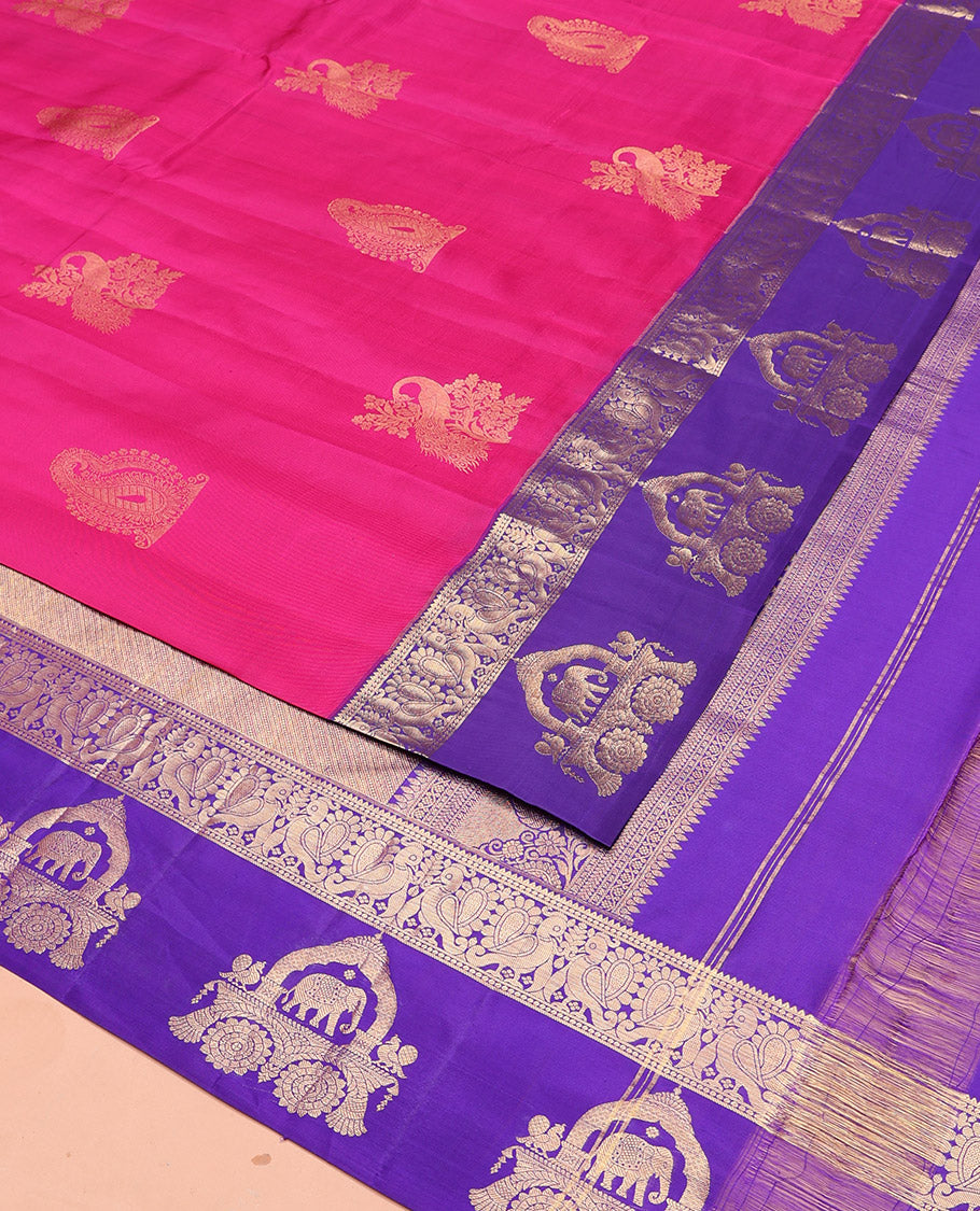 Pink Vasundhara Silk Saree Embellished with Zari Buttas All Over Its Body, Highlighted by Contrast Zari Border of Rekku, Mayil, and Chariot Designs, a Grand Pallu of Diagonal Stripes, and Paired with a Contrast Blouse
