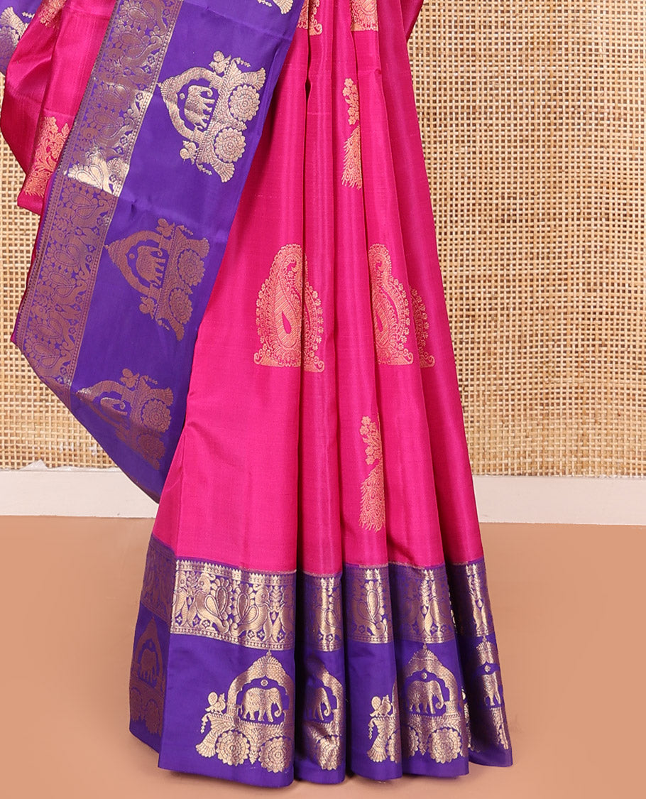 Pink Vasundhara Silk Saree Embellished with Zari Buttas All Over Its Body, Highlighted by Contrast Zari Border of Rekku, Mayil, and Chariot Designs, a Grand Pallu of Diagonal Stripes, and Paired with a Contrast Blouse