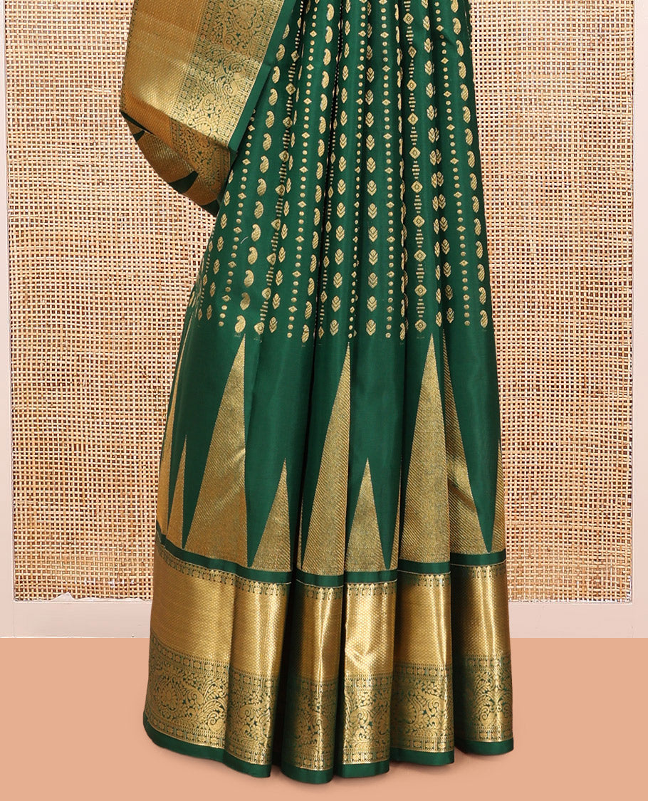 Green Vasundhara Silk Saree, Woven with Zari Buttas, a Zari Thazampoo Rekku Border of Kuyil Kann, Muthu, Star Vanki, and Jada Nagam Designs, Grand Pallu, and a Matching Blouse
