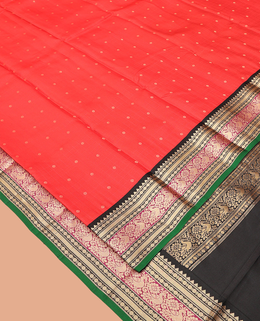 Red Vasundhara Silk Saree, Sparsely Woven with Zari Buttas All Over Its Body, Complemented by a Contrast Border of Rekku, Muthu, Poun, Kathir, and Mayil Designs, Beautifully Bedecked Pallu, and Paired with a Contrast Blouse