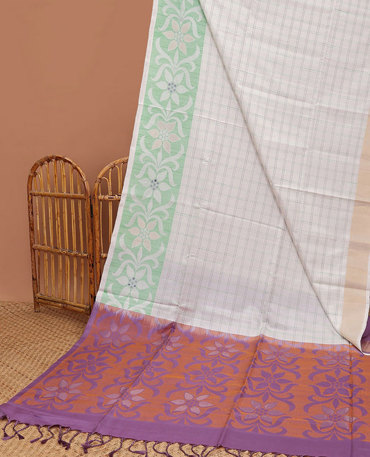 Cream-checked soft silk saree, floral ikkat design border & contrast floral design pallu