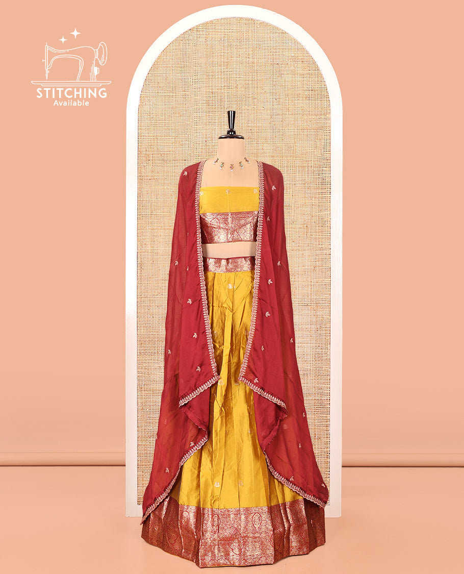 Yellow and Red Semi-Banarasi Half-Saree, Accentulated with Zari Buttas on Its Skirt, Complemented by a Contrast Intricately Zari-Designed Border, Paired with a Matching Blouse, and a Contrast Satin Georgette Embroidered Scallop Dhavani