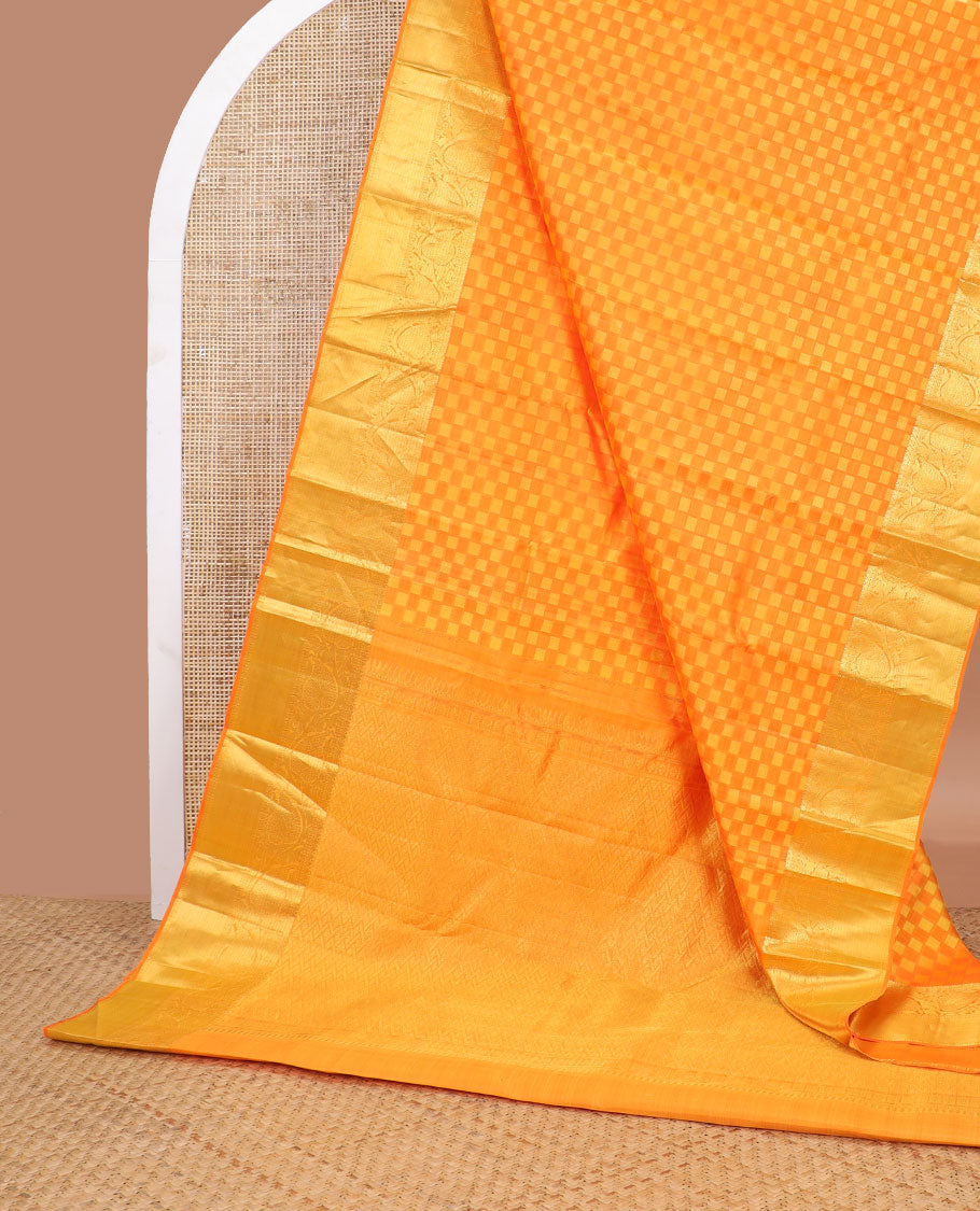 Orange checkered silk saree with self zari border of thilakam mokku, poo chakram, banaras design & zari design pallu