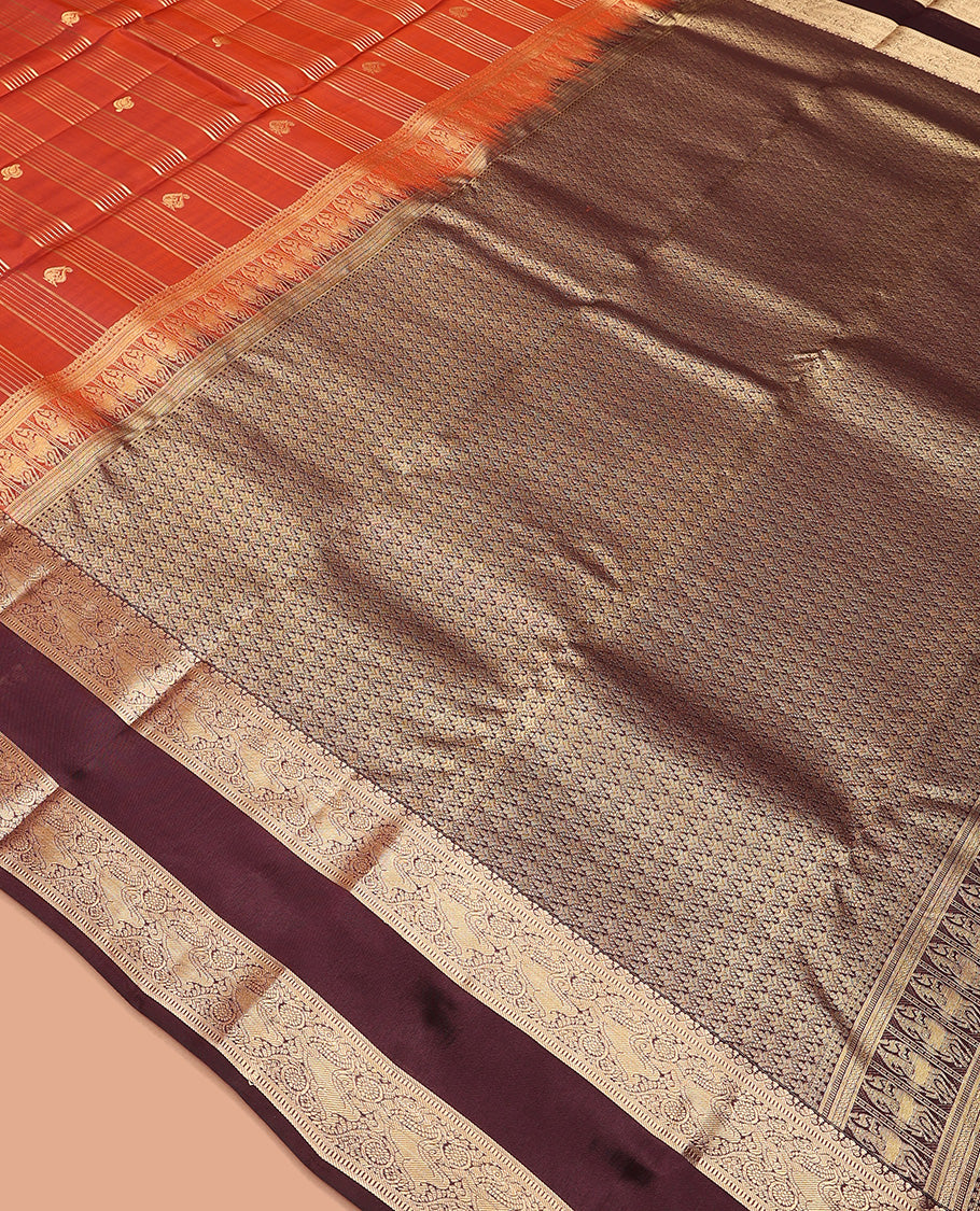 Orange zari buttas and stripes Vasundhara silk mix saree, contrast rettai pettu border of muthu, yaali, and chakram designs, and intricate pallu