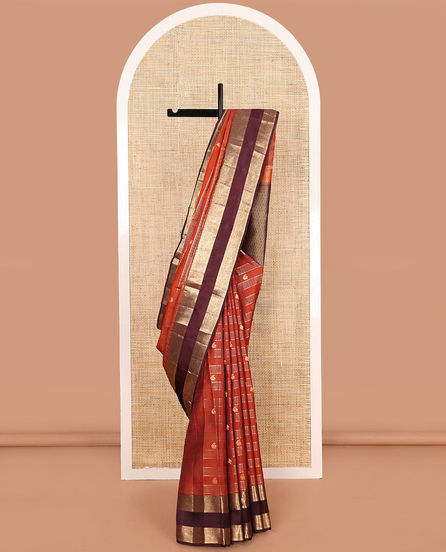 Orange zari buttas and stripes Vasundhara silk mix saree, contrast rettai pettu border of muthu, yaali, and chakram designs, and intricate pallu