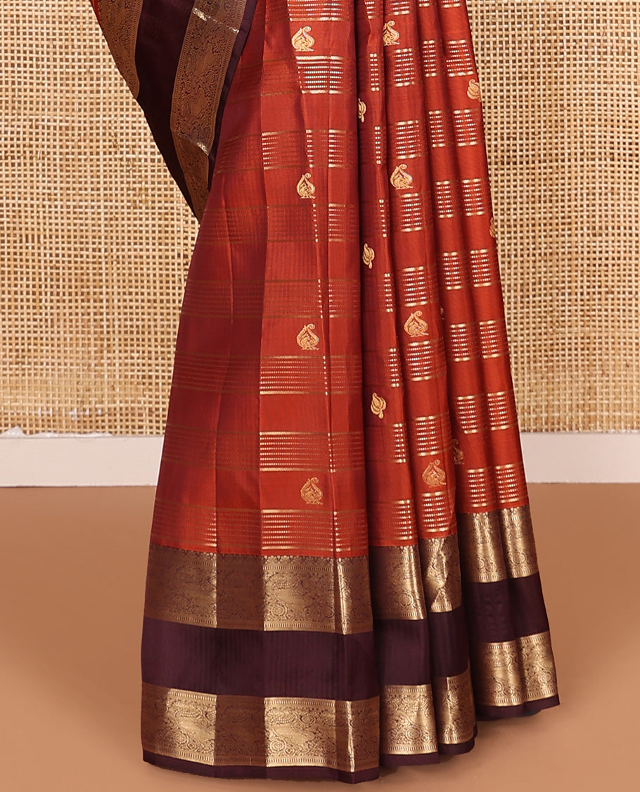 Orange zari buttas and stripes Vasundhara silk mix saree, contrast rettai pettu border of muthu, yaali, and chakram designs, and intricate pallu
