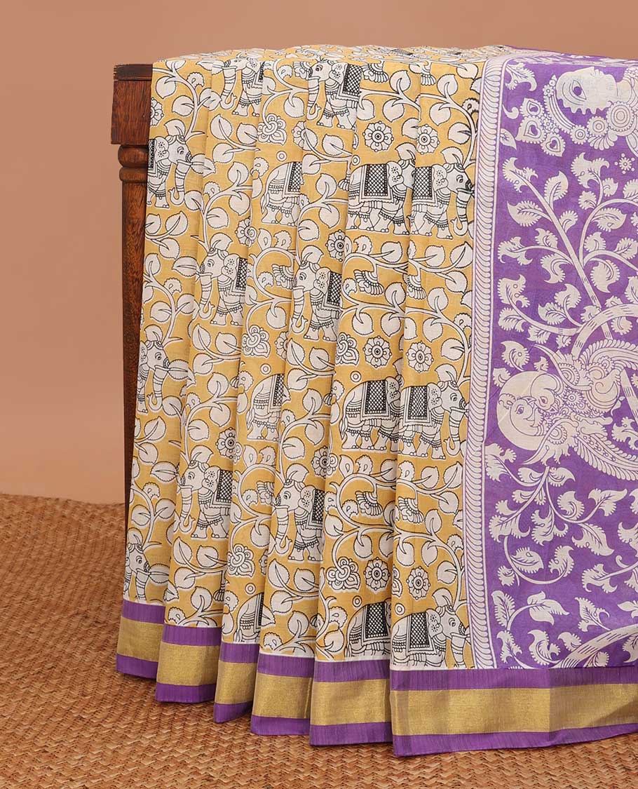 Yellow kalamkari floral vine & elephant printed chirala cotton saree, contrast zari border & pallu of floral, peacock, pichwai cow & lord figurines