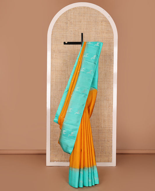 Yellow zari buttas soft silk saree, contrast temple maan motifs border & paiyaadi kann pallu