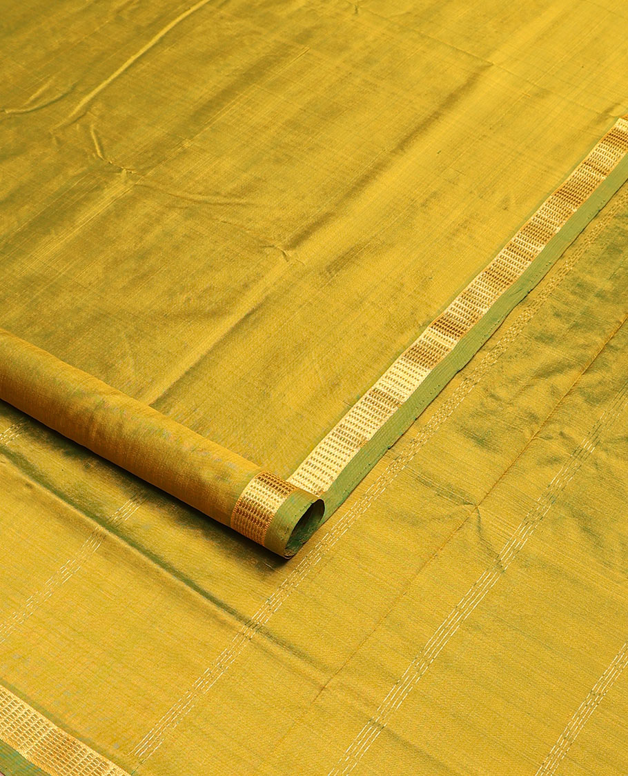 Light green plain nine-yard silk saree, zari border, and pallu of zari designs