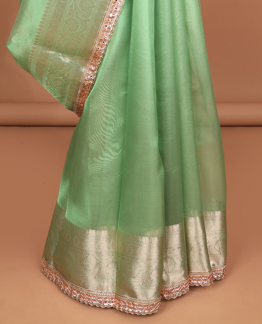 Green tissue saree with self zari design border & intricate zari design pallu