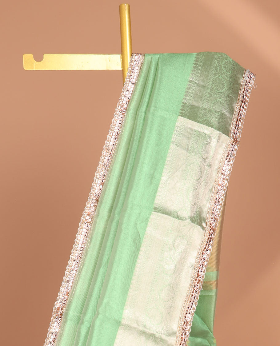 Green tissue saree with self zari design border & intricate zari design pallu