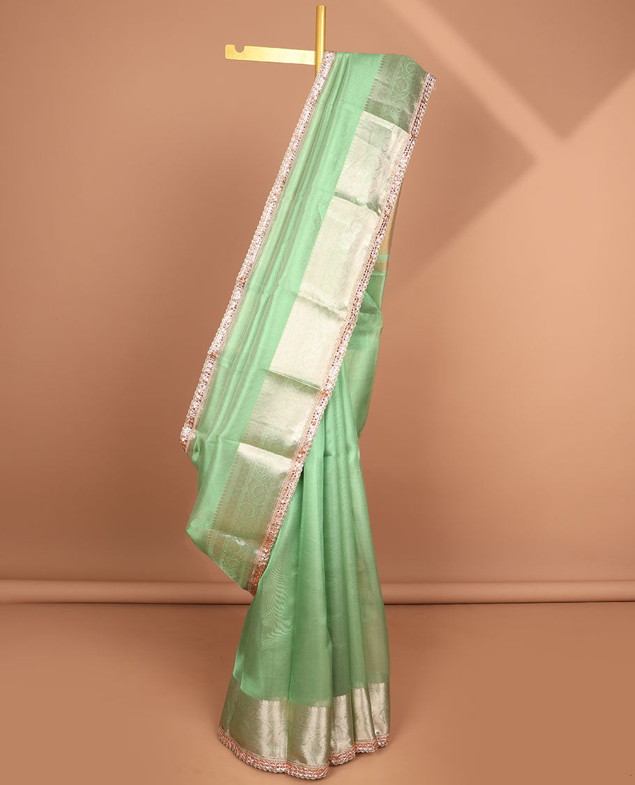 Green tissue saree with self zari design border & intricate zari design pallu