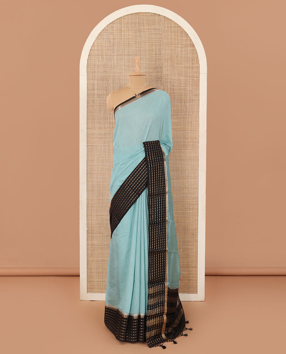 Powder blue plain Assam cotton saree, contrast traditional design border, and pallu of stripes