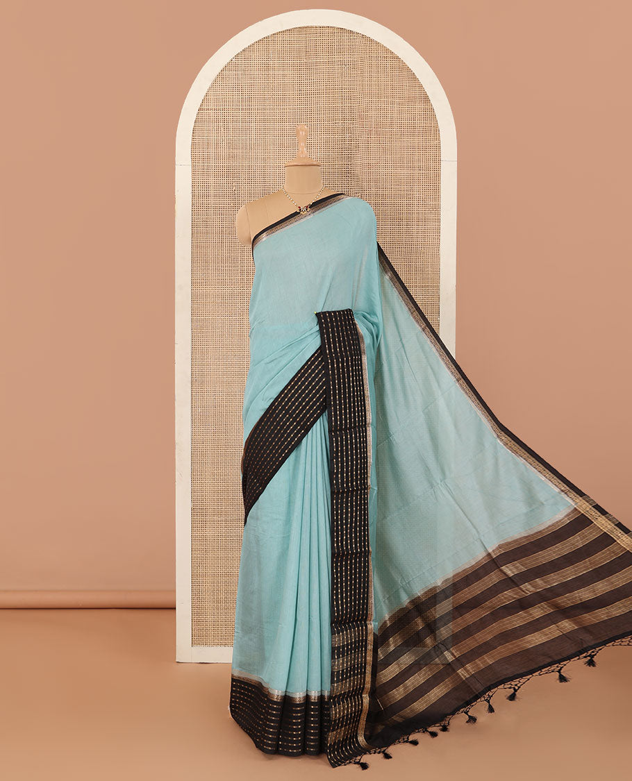 Powder blue plain Assam cotton saree, contrast traditional design border, and pallu of stripes