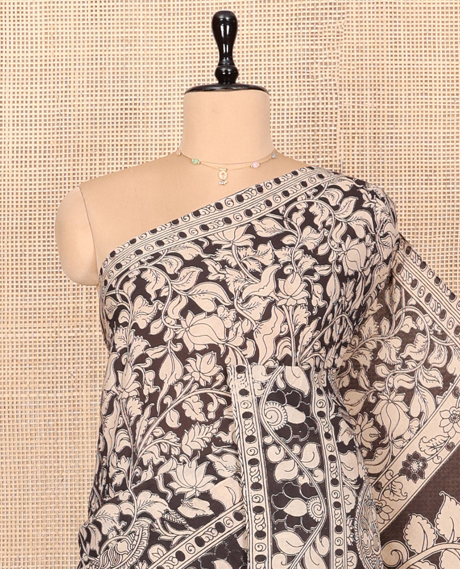 Black Kalamkari Cotton Saree, Impeccably Styled with Floral Vine Print, Floral Printed Border, Pallu of Peacock Motifs, and a Matching Blouse