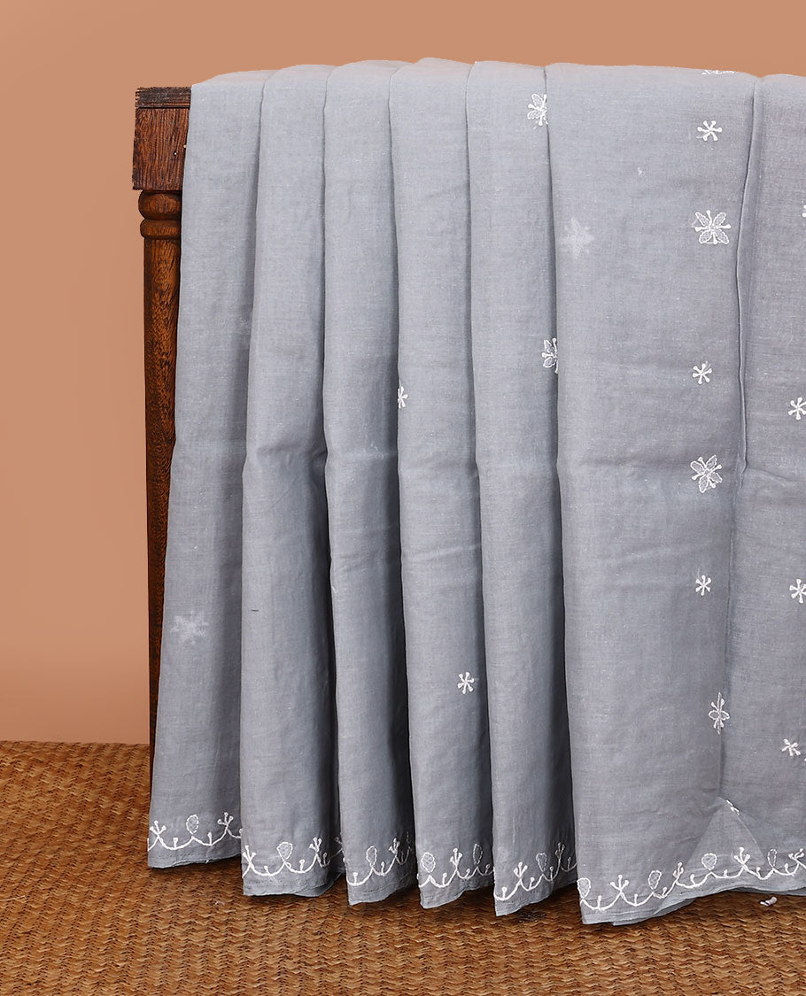 Grey embroidered buttas Lucknowi chikankari saree, thread embroidered border, and floral-paisley motifs embroidered pallu