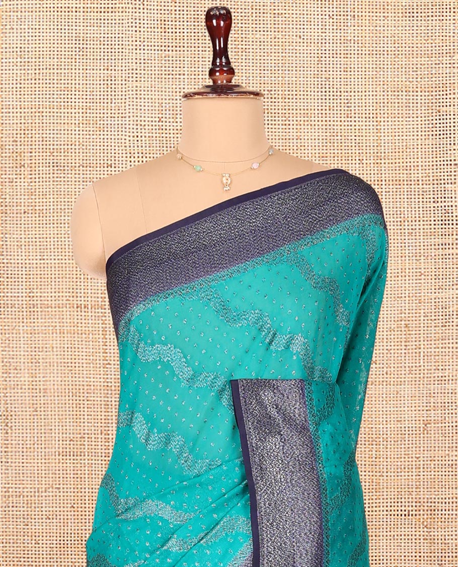Blue Dola Silk Saree, Woven with Zari Buttas and Chevron on Its Body, Complemented by Contrast Zari Border, Gleaming Zari Pallu, and Paired with a Contrast Blouse