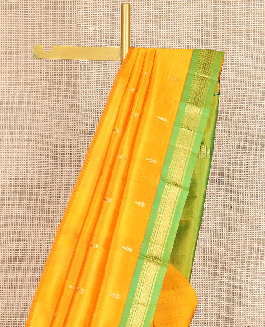Yellow zari buttas kanchipuram silksaree, contrast one-sided border of paneer sombu,banaras & mayil kann design & zari design pallu