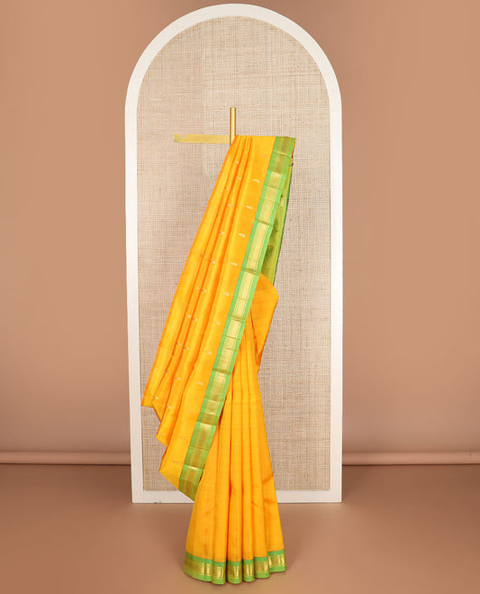 Yellow zari buttas kanchipuram silksaree, contrast one-sided border of paneer sombu,banaras & mayil kann design & zari design pallu