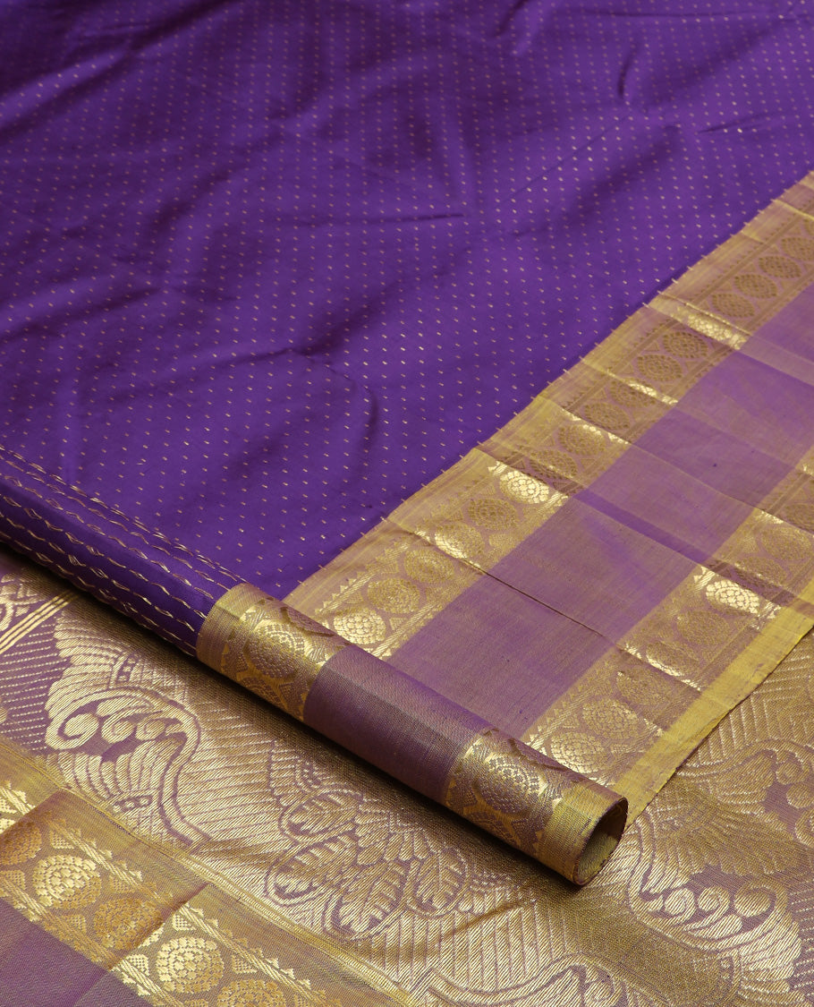 Blue zari buttas Kanchipuram silk saree, contrast one-sided rettai pettu border of rekku and poo chakram, and zari design pallu