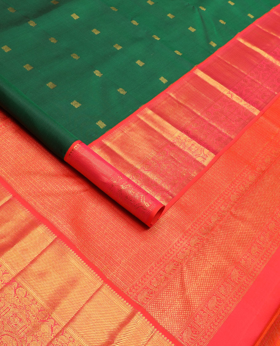 Green zari buttas Kanchipuram silk saree, contrast border of thilakam mokku, banaras, muthu, and mayil designs, and pallu of neli designs