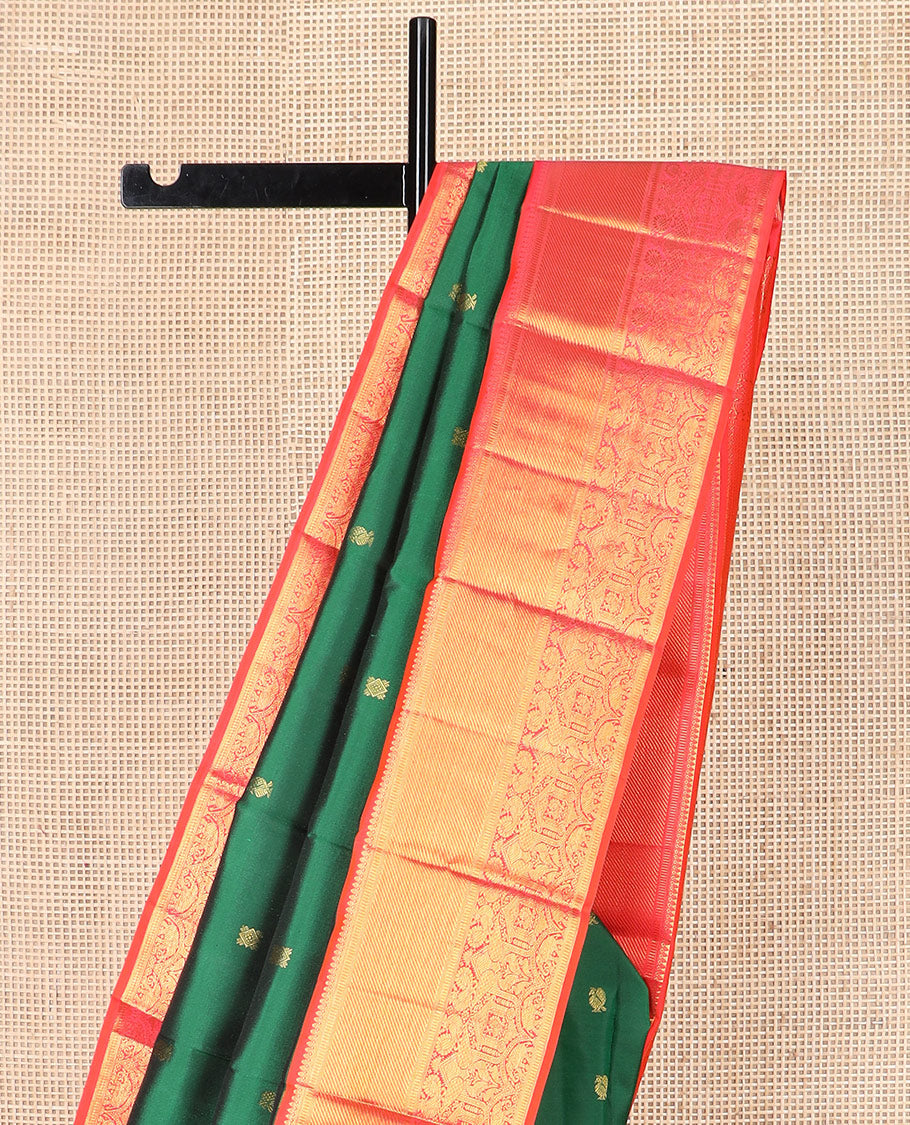 Green zari buttas Kanchipuram silk saree, contrast border of thilakam mokku, banaras, muthu, and mayil designs, and pallu of neli designs