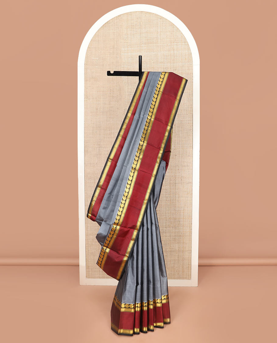 Grey Striped Kanchipuram Silk Saree Adorned with a Contrast Rettai Pettu Border Featuring Manga, Banaras, and Mayil Kann Designs, a Subtle Striped Pallu, and a Contrast Blouse