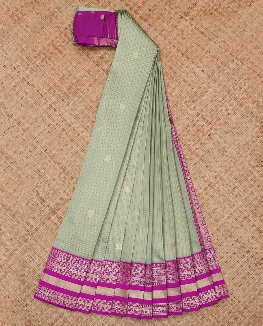 Green Litchi Saree, Crafted with Peacock-Chakram Buttas and Checks, a Contrast Traditional Zari Border, Intricate Pallu, and a Contrast Blouse