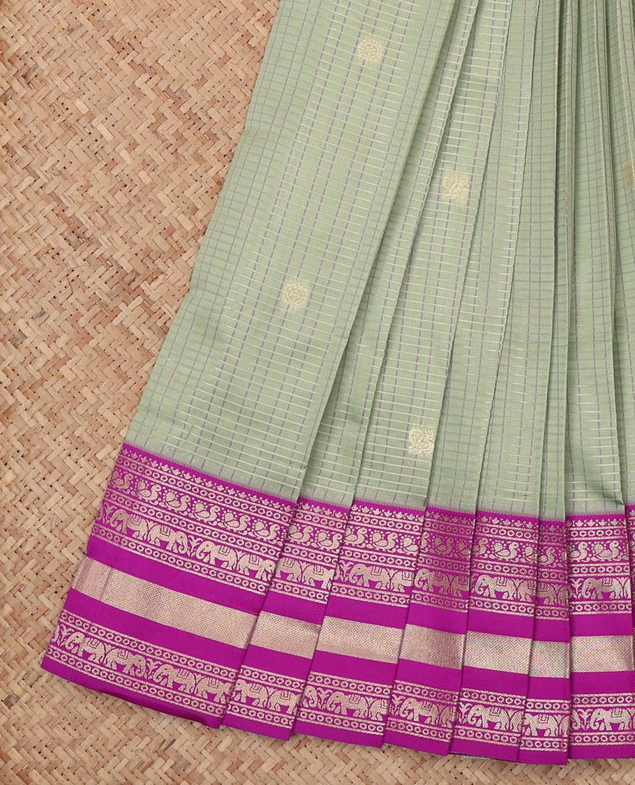 Green Litchi Saree, Crafted with Peacock-Chakram Buttas and Checks, a Contrast Traditional Zari Border, Intricate Pallu, and a Contrast Blouse