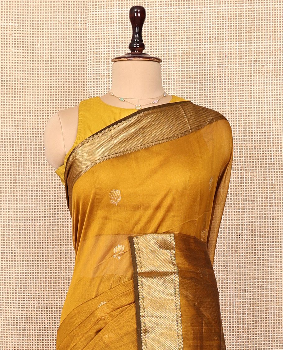 Mustard Maheshwari Cotton Saree, Beautified with Floral Buttas on Its Body, Highlighted by a Zari Border of Traditional Designs, Pallu Steeped with Gleaming Zari Stripes, and Paired with a Matching Blouse