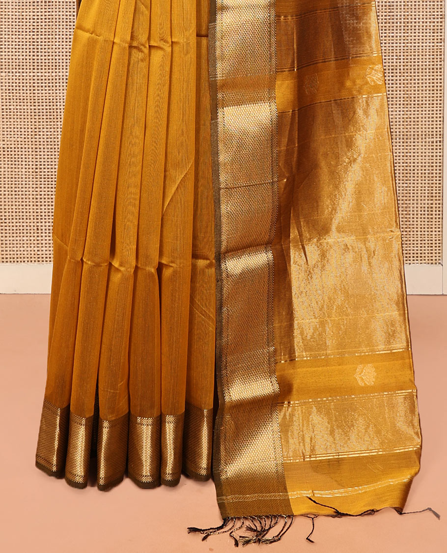 Mustard Maheshwari Cotton Saree, Beautified with Floral Buttas on Its Body, Highlighted by a Zari Border of Traditional Designs, Pallu Steeped with Gleaming Zari Stripes, and Paired with a Matching Blouse